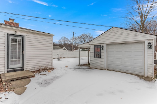 view of snow covered garage