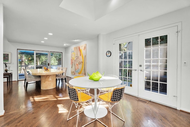 dining space featuring hardwood / wood-style flooring and french doors