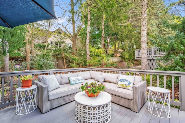 wooden terrace featuring an outdoor hangout area