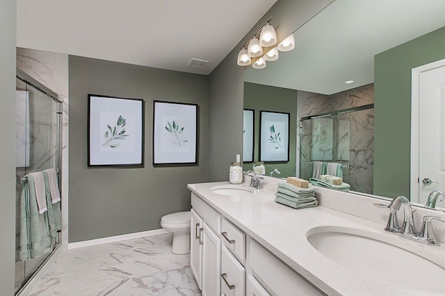 bathroom featuring a sink, a marble finish shower, and marble finish floor