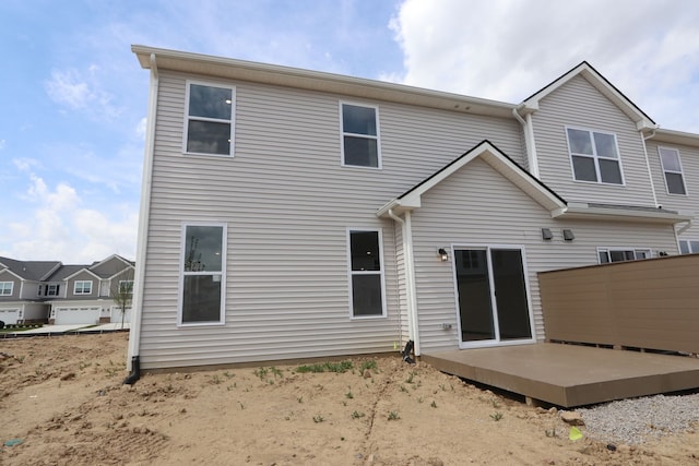 rear view of property with a wooden deck