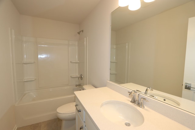 bathroom featuring tile patterned flooring, tub / shower combination, toilet, and vanity