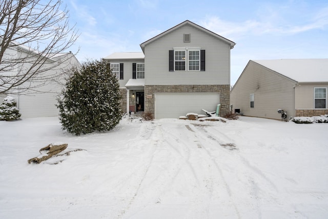 view of front of property with a garage