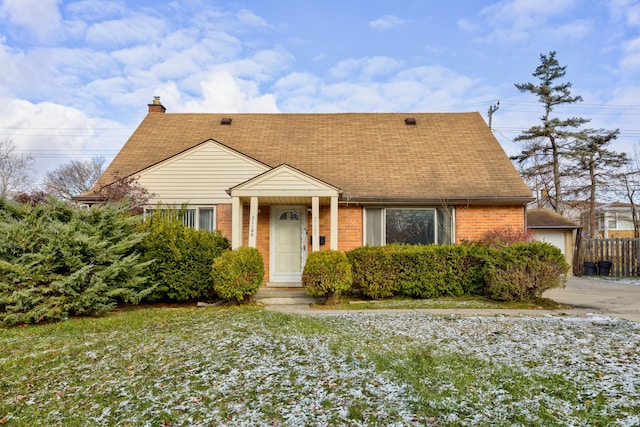 bungalow-style house featuring a front yard