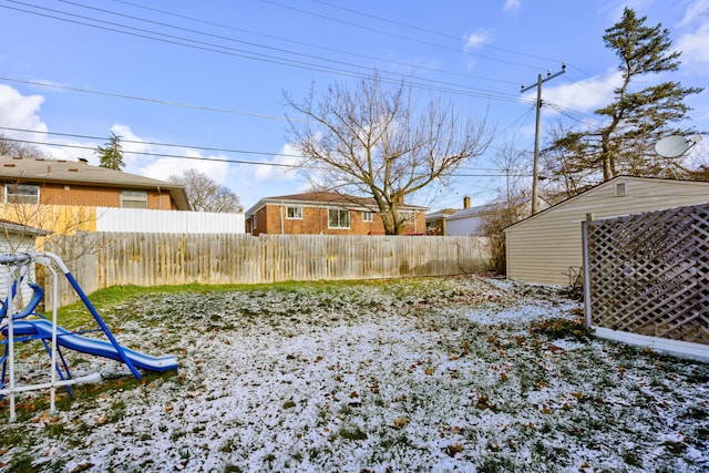 view of yard covered in snow