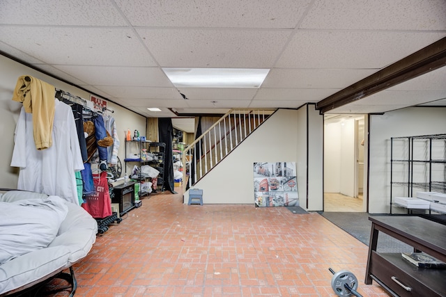 basement featuring a paneled ceiling