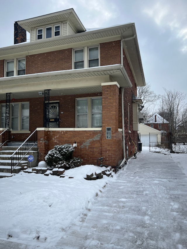 view of front of property with a porch and central AC