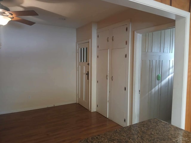 hallway featuring dark hardwood / wood-style flooring