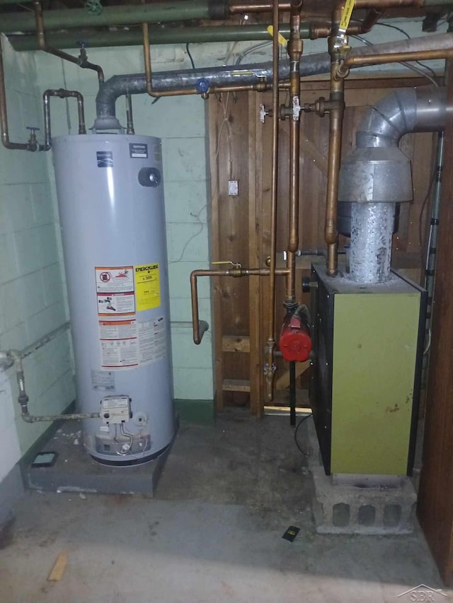 utility room featuring gas water heater