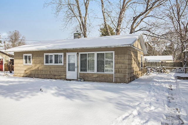 view of snow covered house