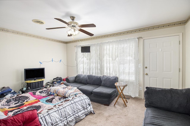 carpeted living room featuring ceiling fan