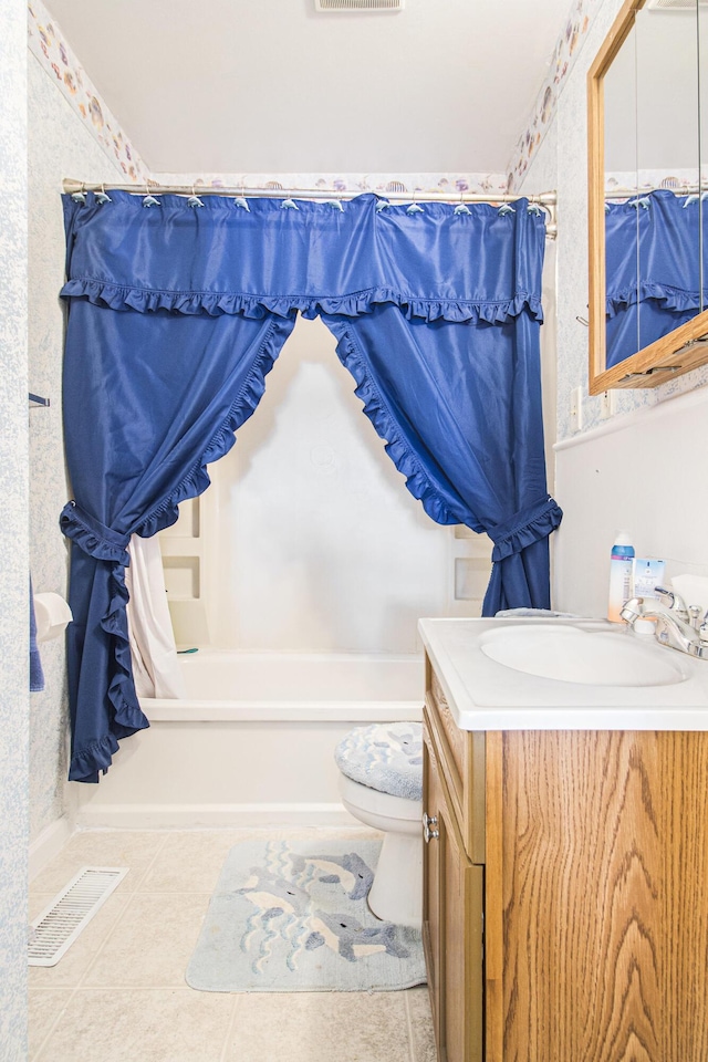 full bathroom featuring vanity, tile patterned flooring, toilet, and shower / bathtub combination with curtain