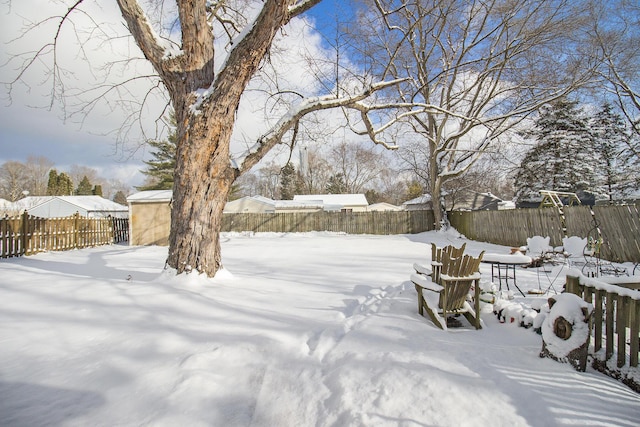 view of yard covered in snow