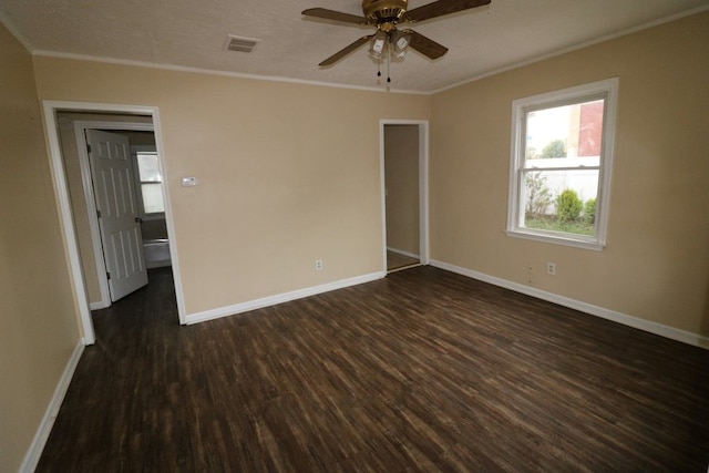 unfurnished room with dark wood-type flooring, ceiling fan, and ornamental molding