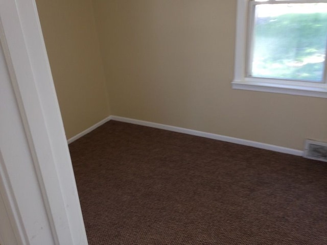 27116 Seyburn Ave, Warren, MI 48092 - spare room with dark carpet and baseboards