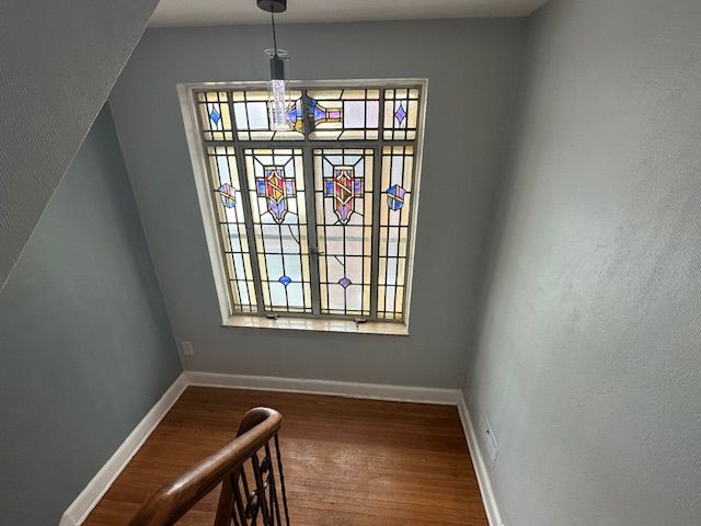 unfurnished dining area with hardwood / wood-style flooring and a healthy amount of sunlight