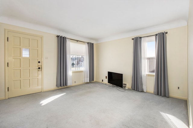 unfurnished living room with light carpet