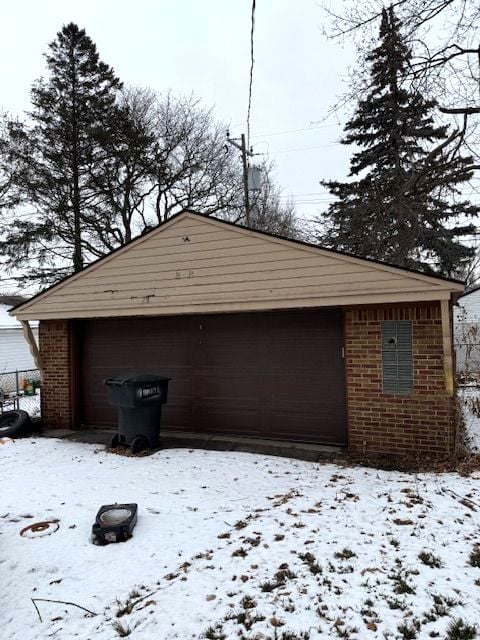 view of snow covered garage