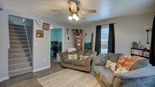 living room featuring hardwood / wood-style flooring and ceiling fan