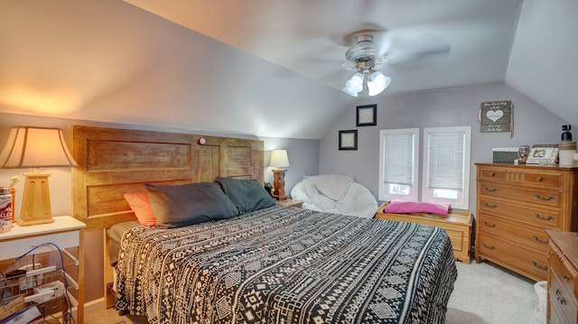 carpeted bedroom with lofted ceiling and ceiling fan