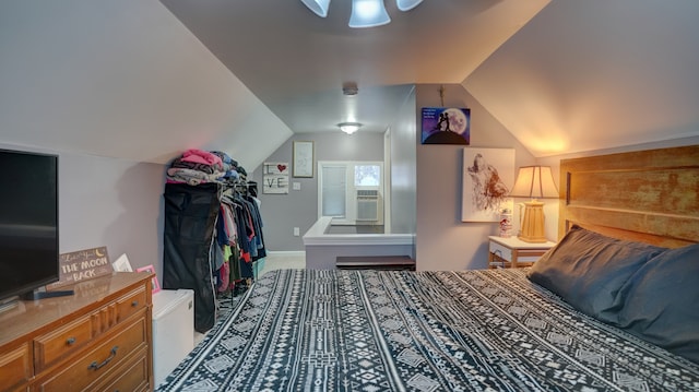 bedroom with lofted ceiling