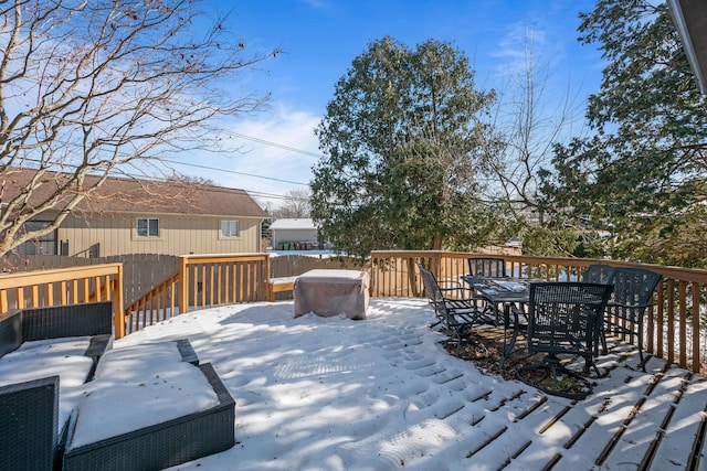 view of snow covered deck