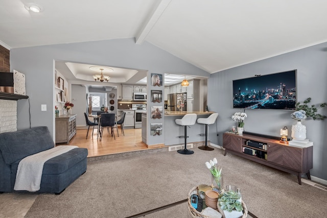 carpeted living room featuring an inviting chandelier and lofted ceiling with beams