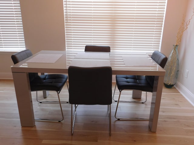 dining area with wood-type flooring