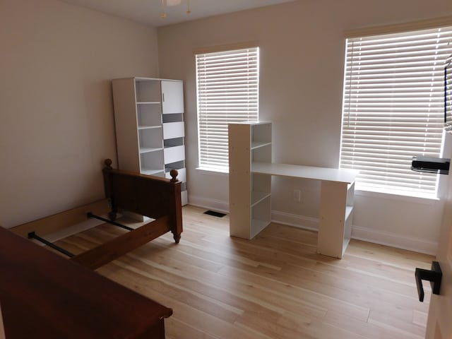 bedroom with light hardwood / wood-style floors