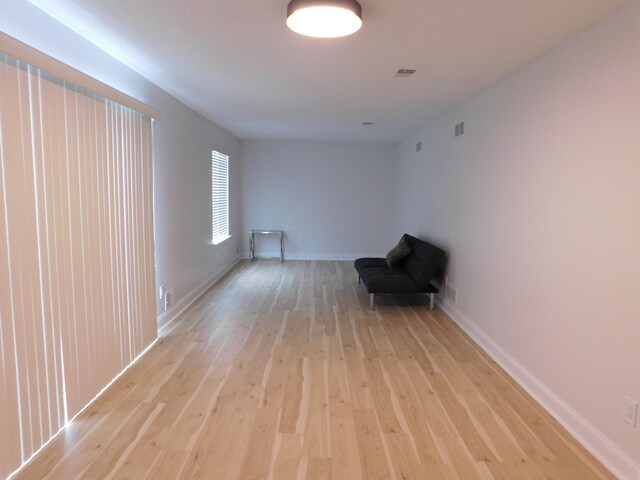 unfurnished room with light hardwood / wood-style floors