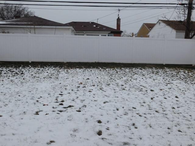 view of yard covered in snow