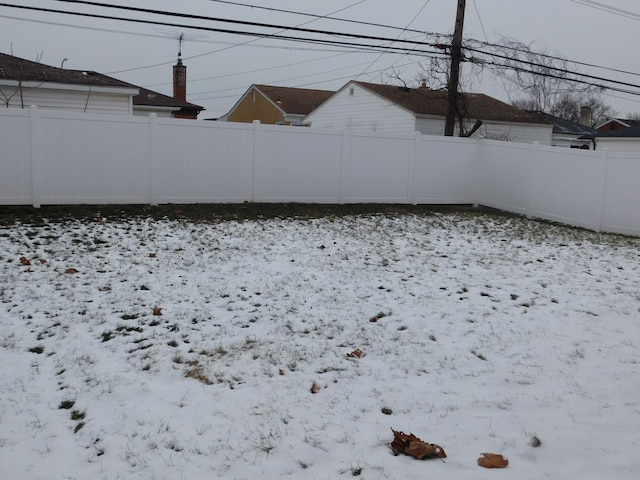 view of yard layered in snow