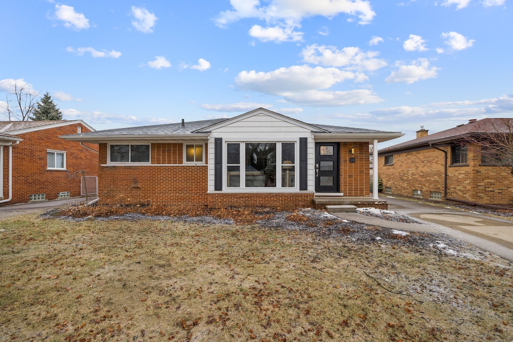 rear view of house with a yard