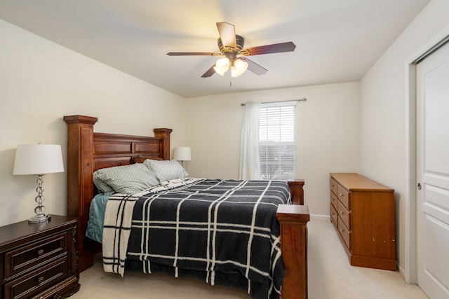 carpeted bedroom featuring ceiling fan