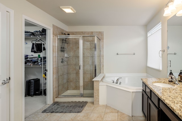 bathroom with vanity, separate shower and tub, and tile patterned floors