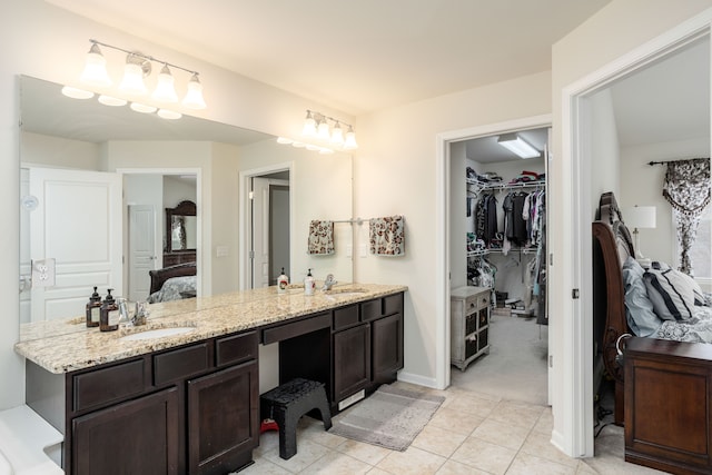 bathroom with vanity and tile patterned floors