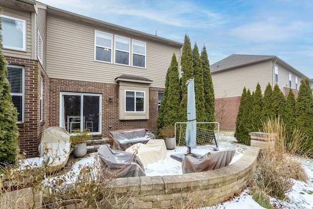 view of snow covered house