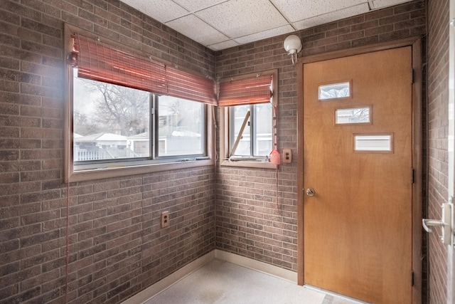 entryway with a drop ceiling