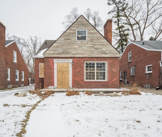 view of snow covered house