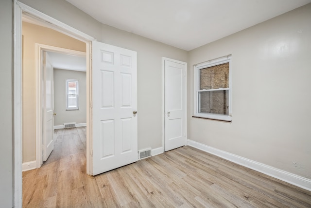 unfurnished bedroom featuring light hardwood / wood-style floors