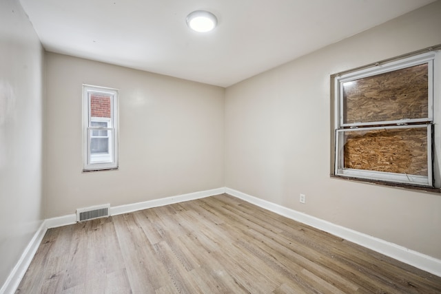 unfurnished room featuring light wood-type flooring