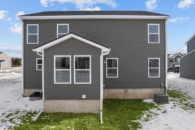 rear view of property with central air condition unit