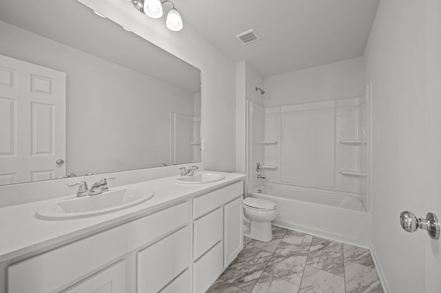 bathroom featuring toilet, visible vents, marble finish floor, and a sink