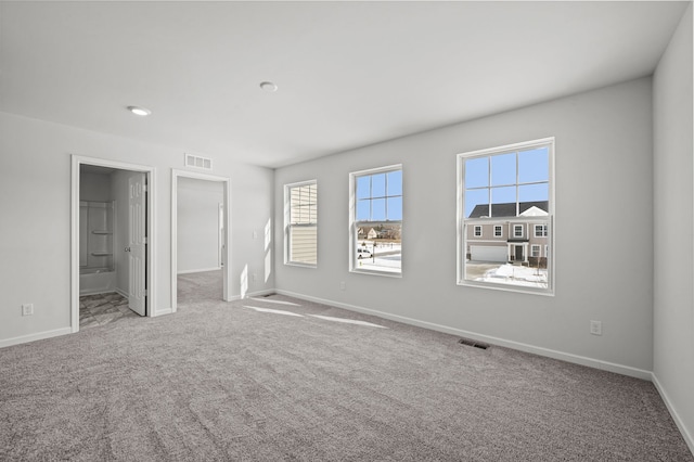 unfurnished bedroom with visible vents, carpet flooring, and baseboards