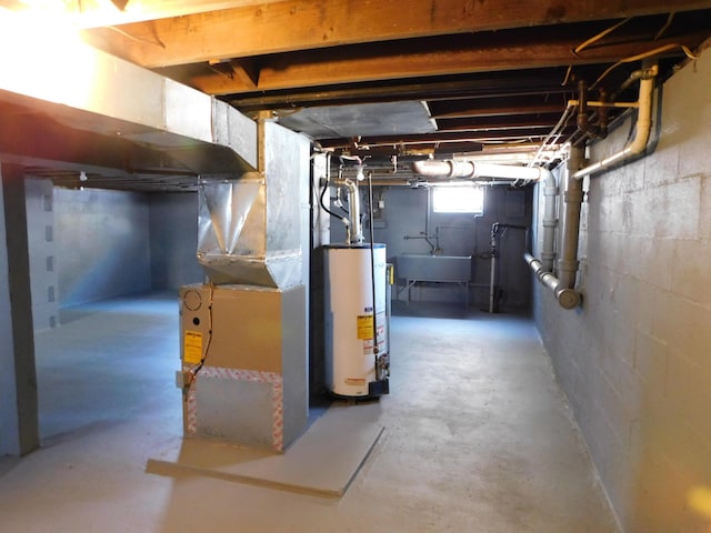1336 Agard Ave, Benton Harbor, MI 49022 - below grade area with water heater, heating unit, and a sink