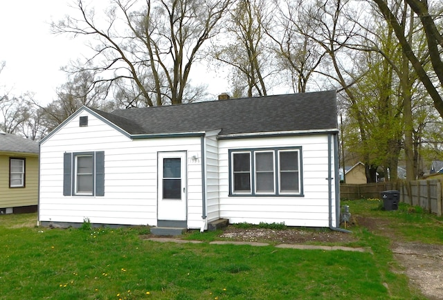 1336 Agard Ave, Benton Harbor, MI 49022 - single story home with fence, a shingled roof, entry steps, and a front lawn