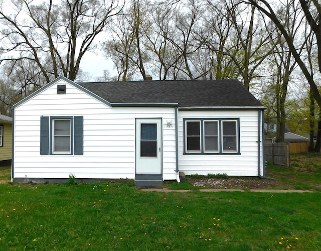 1336 Agard Ave, Benton Harbor, MI 49022 - ranch-style house featuring fence, roof with shingles, and a front yard