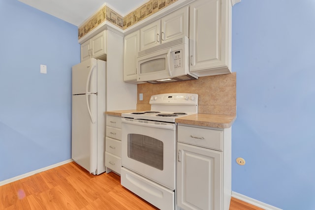 kitchen featuring white cabinets, white appliances, decorative backsplash, and light wood-type flooring