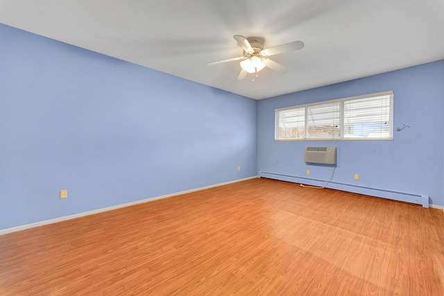 unfurnished room featuring a baseboard heating unit, light hardwood / wood-style flooring, an AC wall unit, and ceiling fan