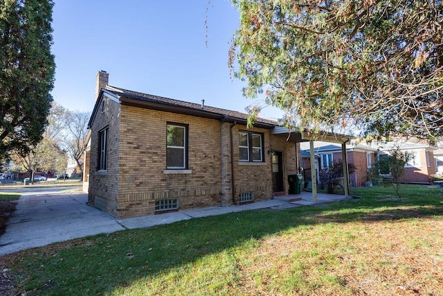 rear view of house featuring a yard